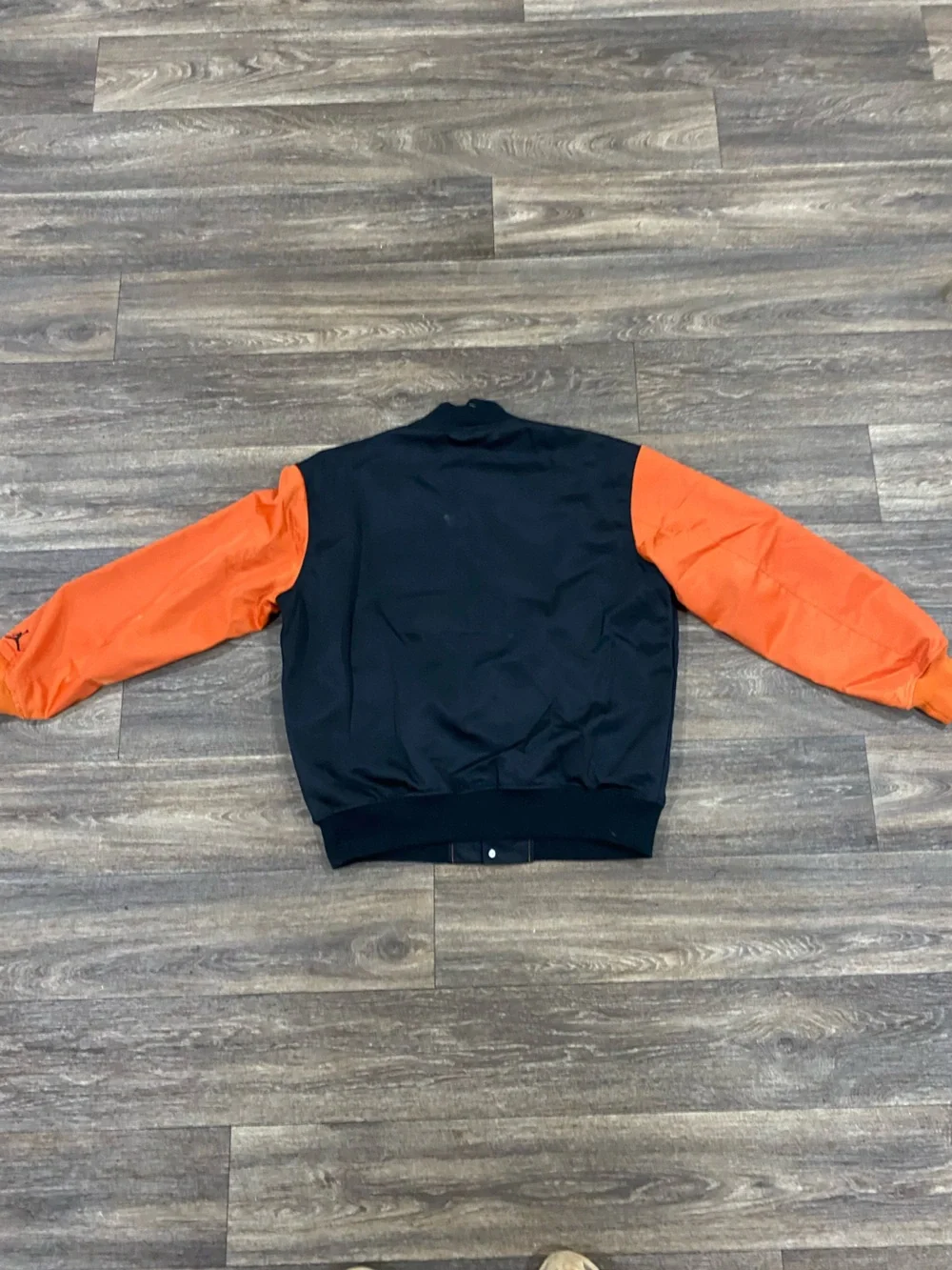 Jordan Black Jacket with White and Orange Lettering